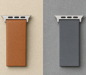 Zwei Armbandabschnitte nebeneinander auf zweigeteiltem Untergrund, links braunes Leder auf Sandton, rechts graues Silikon auf Schiefergrau, beide mit identischem Anschlussstück. Mit KI erstellte Materialdarstellung.